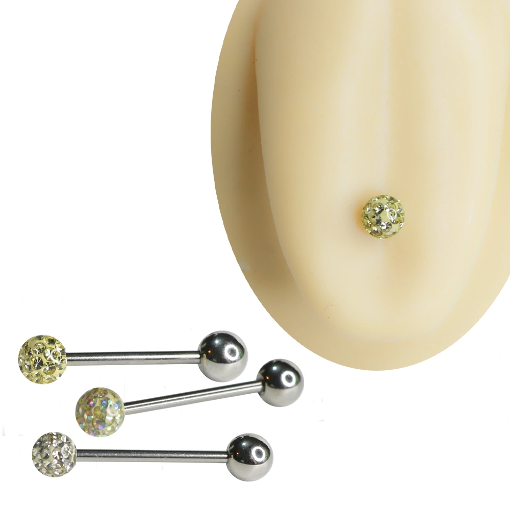 Gümüş renkli cerrahi çelik dil piercing üzerinde yer alan yüzeyi minik parlak taşlarla kaplı beyaz, gökkuşağı ve sarı renk seçenekleri