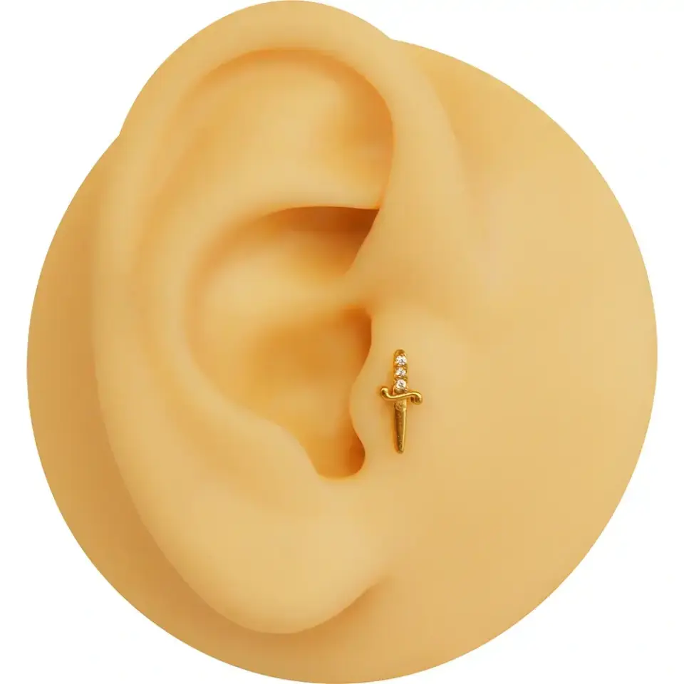 316l-cerrahi-celik-kilic-figurlu-kulak-piercing-gold