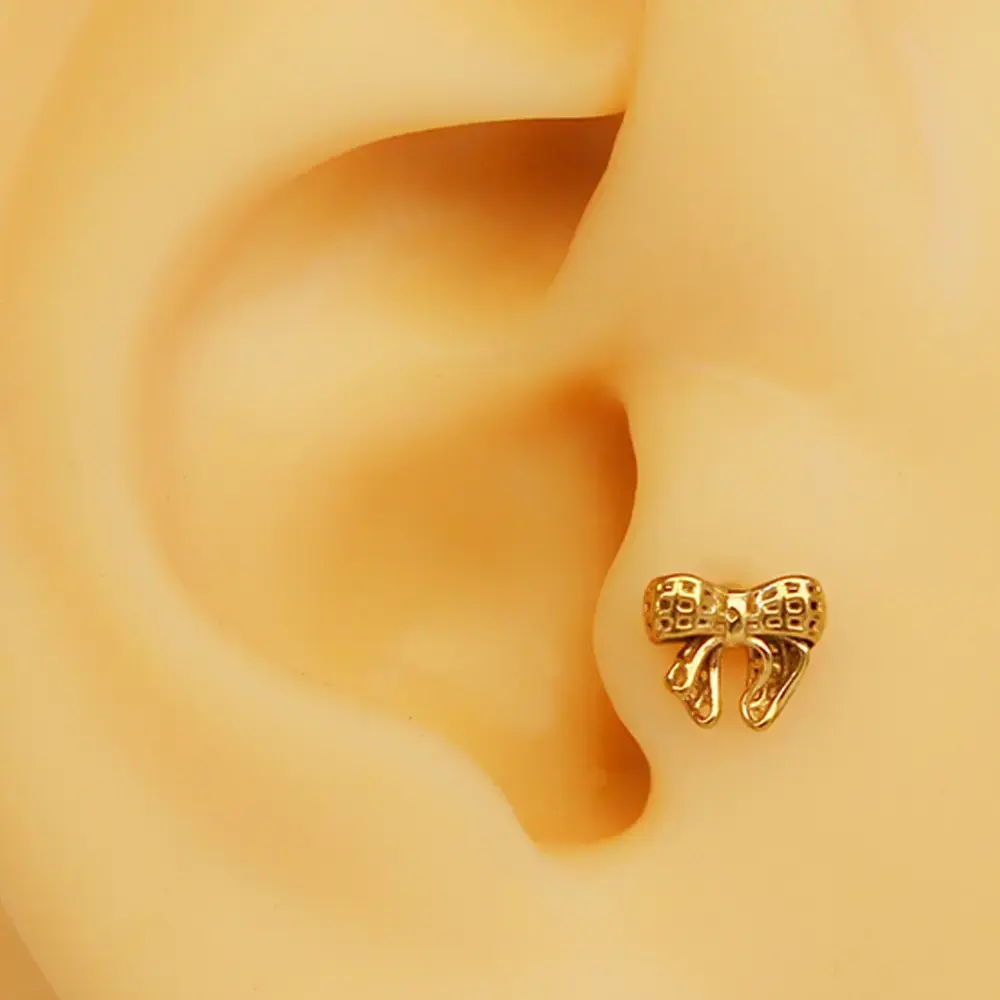 gold-fiyonk-tasarim-tragus-helix-kikirdak-piercing-modeli