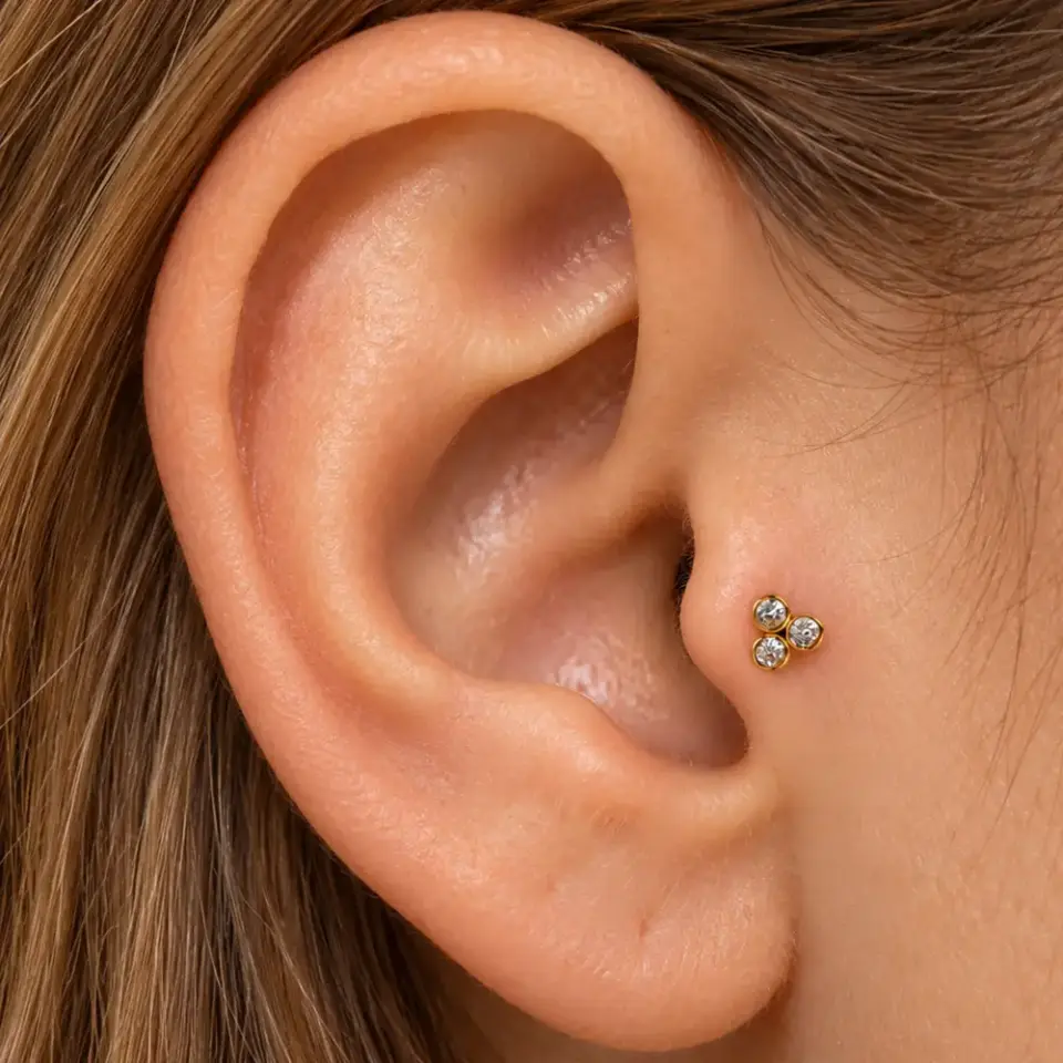 uc-tas-gold-tragus-piercing
