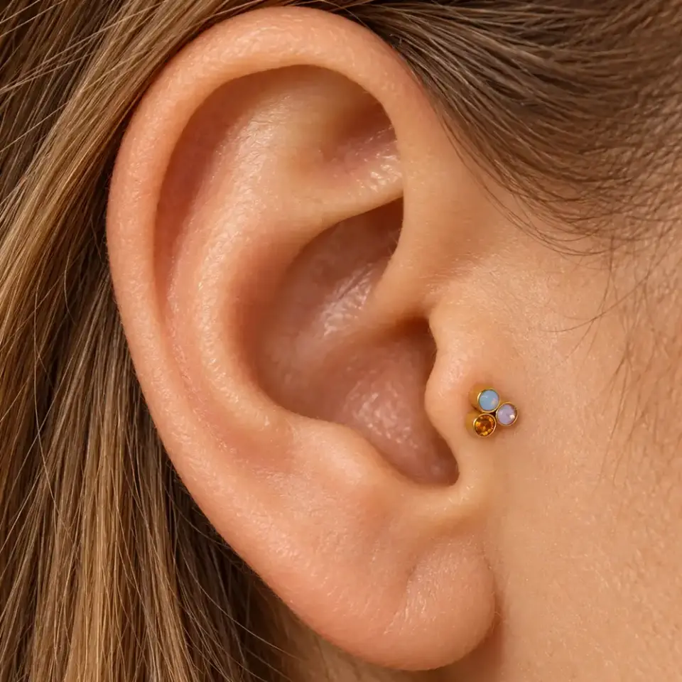 uc-opal-tas-tragus-piercing