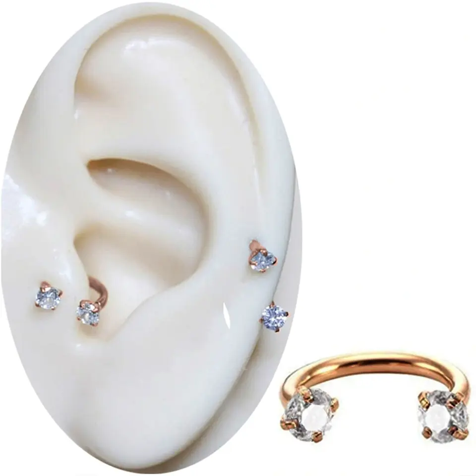 Dudak ve tragus bölgesinde sergilenen rose kararmayan zirkon taşlı dudak burun kıkırdak piercing