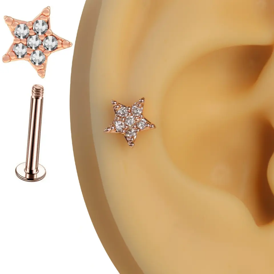 Rose gold pembe ışıltı yıldız tragus helix kıkırdak piercing kulak üzerinde görünümü.