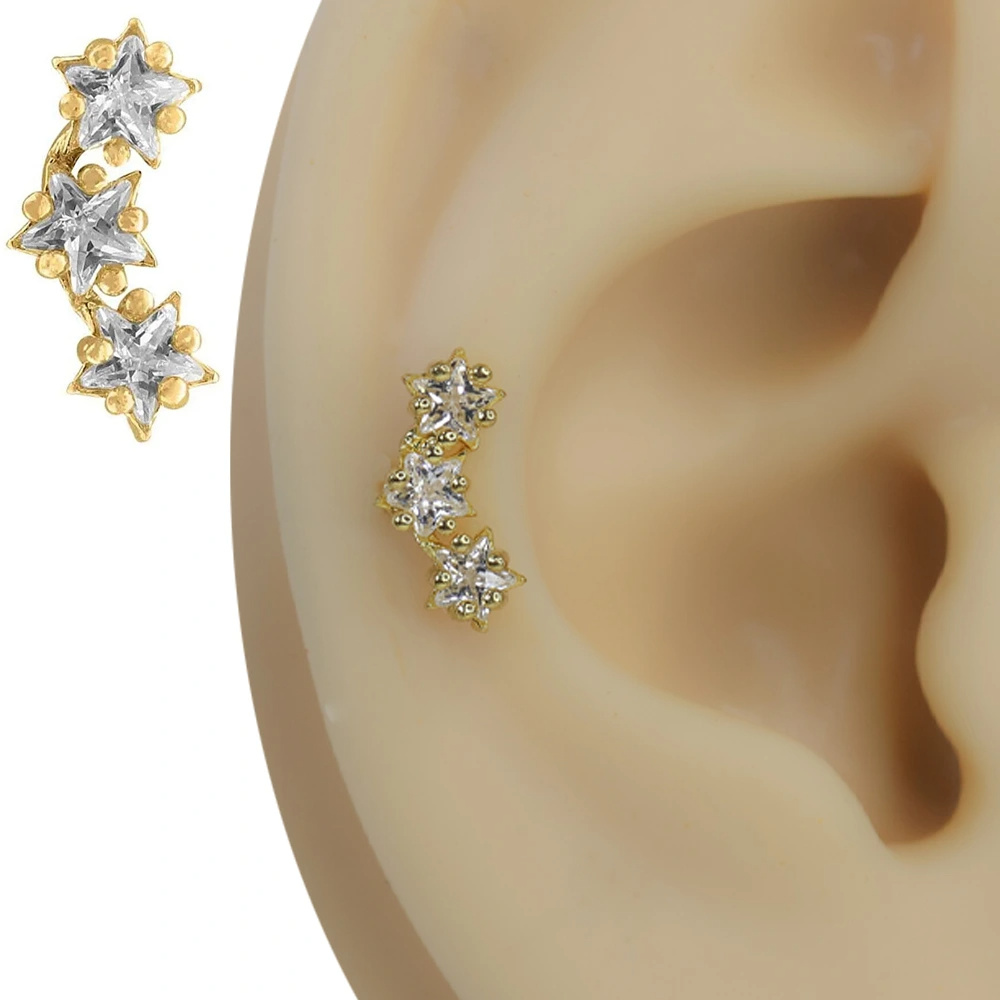 Altın rengi yıldız yağmuru üçlü yıldız zirkon taşlı tragus helix kıkırdak piercing kulak üzerindeki dikey ve parıltılı duruşu