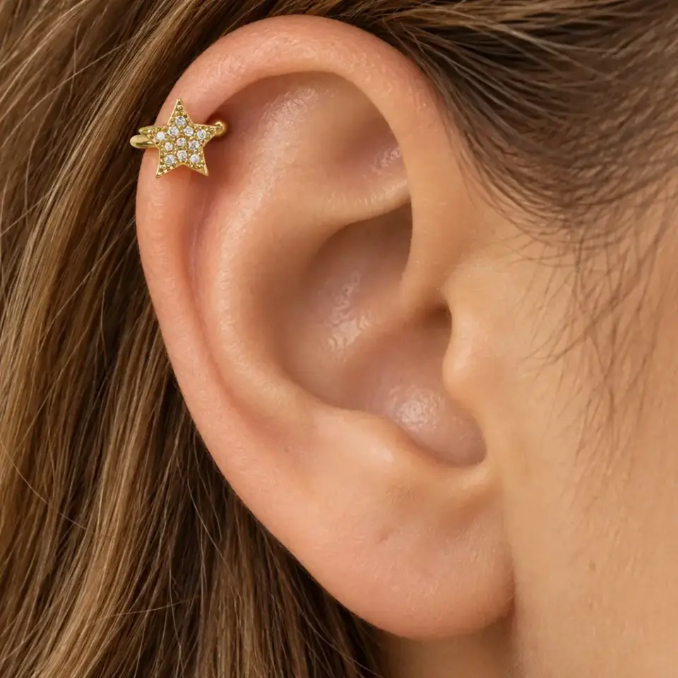 kuzey-isigi-gold-sikistirma-kikirdak-piercing-kulakta-durusu