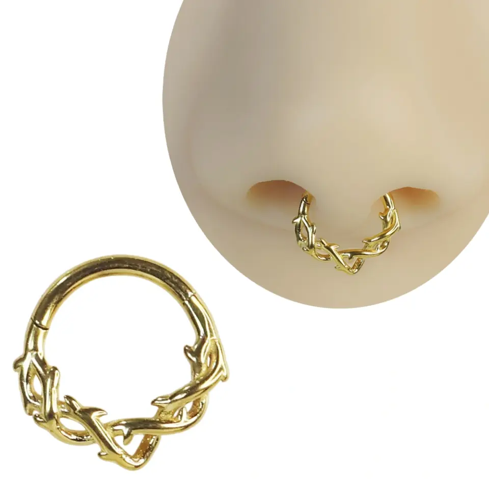 Septum ve tragus bölgesinde sergilenen altın kararmayan dikenli halka septum kıkırdak piercing