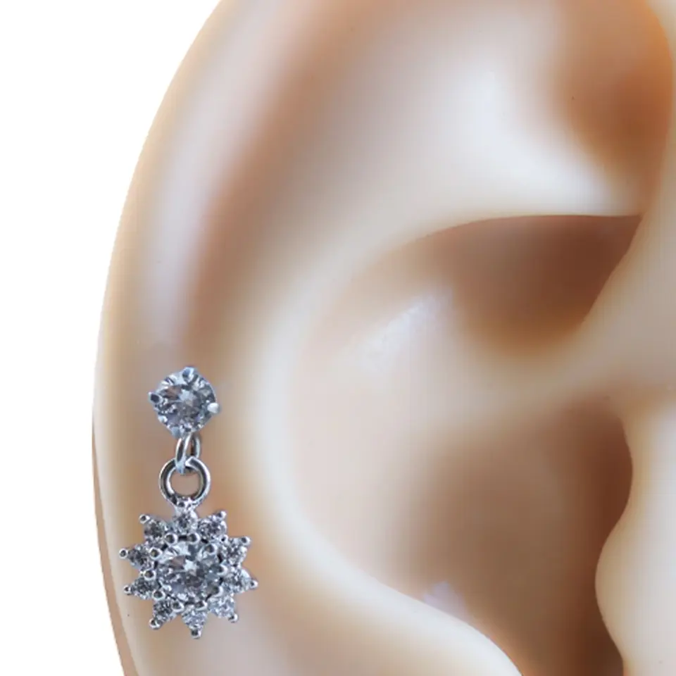 Işık patlaması model tragus helix kıkırdak piercing renk seçenekleri ve teknik detayları.