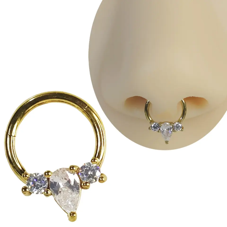 Septum ve tragus bölgesinde sergilenen altın kararmayan damla halka septum kıkırdak piercing