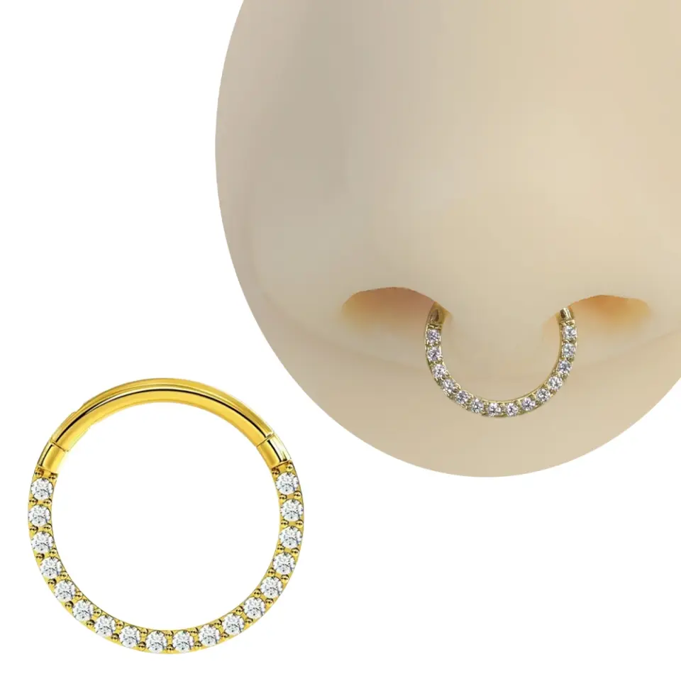 Septum ve tragus bölgesinde sergilenen altın kararmayan halka septum kıkırdak piercing