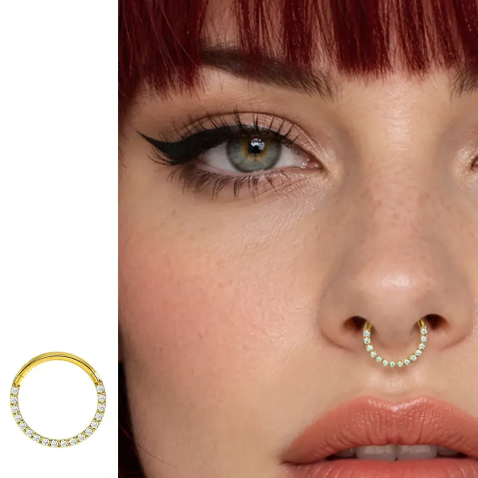 sira-tasli-gold-septum-piercing