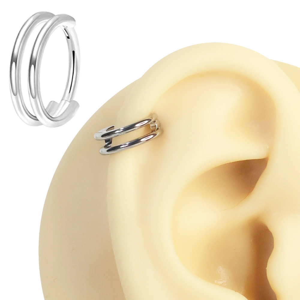Septum ve tragus bölgesinde sergilenen gümüş kararmayan ikili halka septum kıkırdak piercing