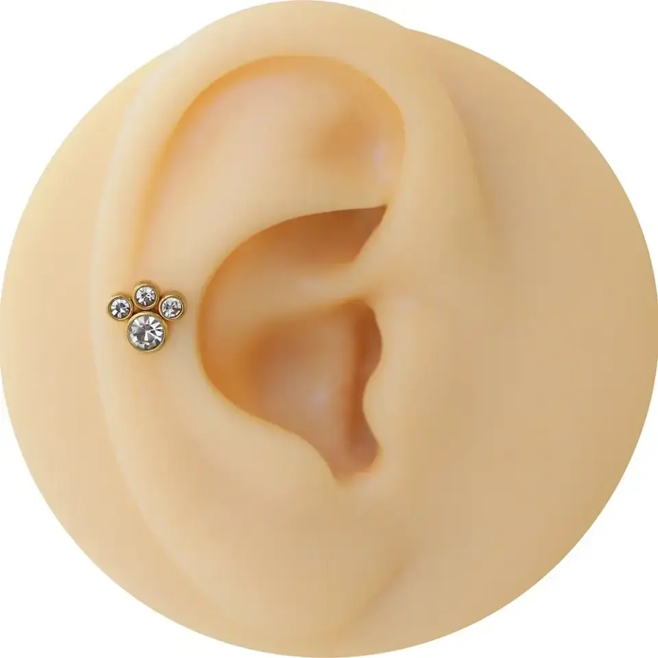 Sarı renk pati modelli zirkon taşlı çelik flatback piercing.