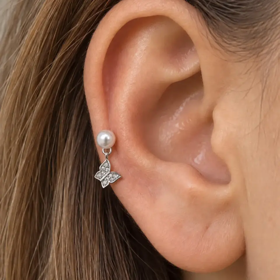 kelebek-tragus-piercing-kulakta-durusu