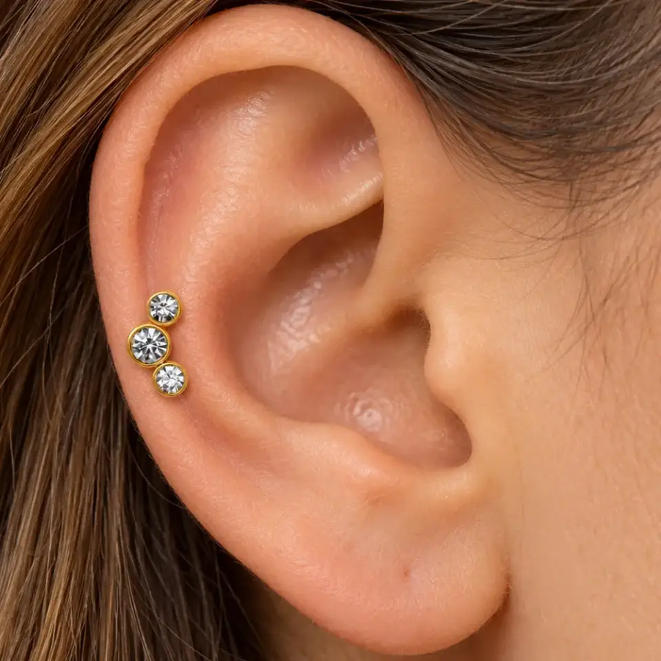 uc-tas-gold-tragus-piercing
