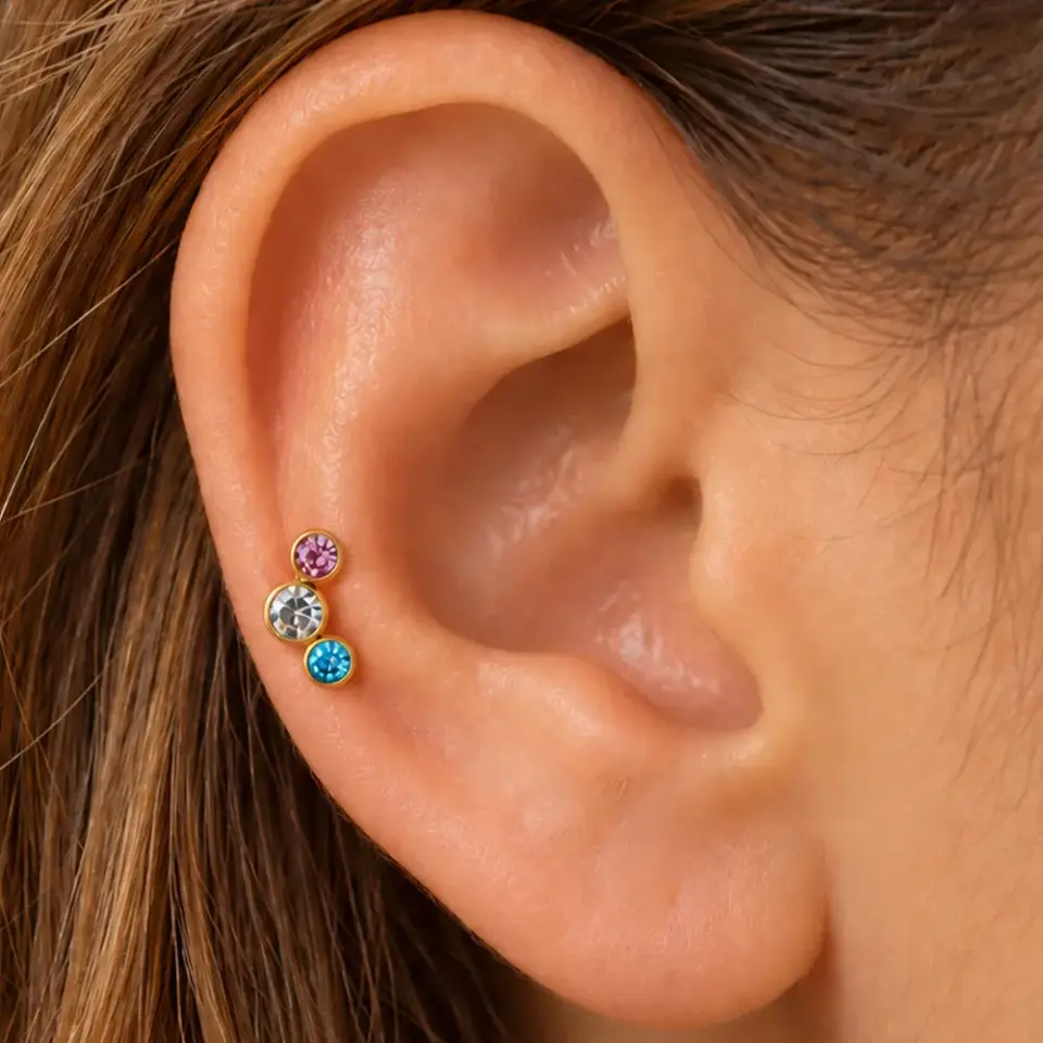 renkli-uc-tas-gold-tragus-piercing