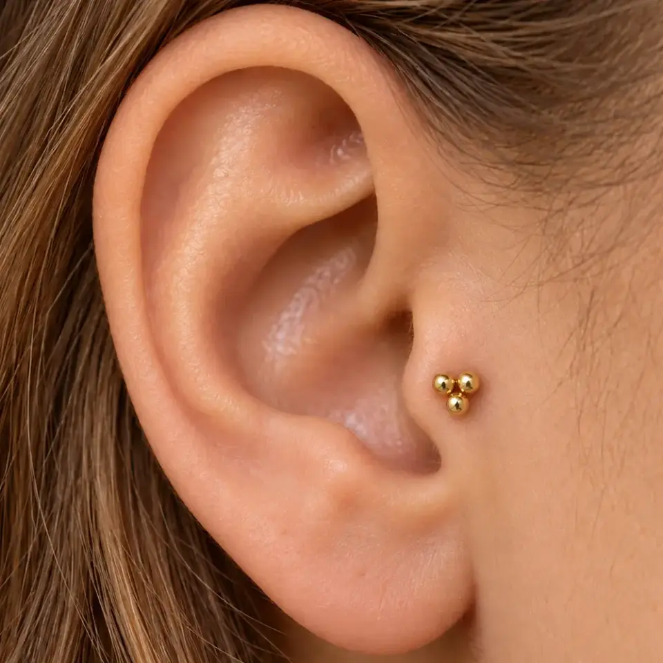 uc-top-gold-tragus-piercing
