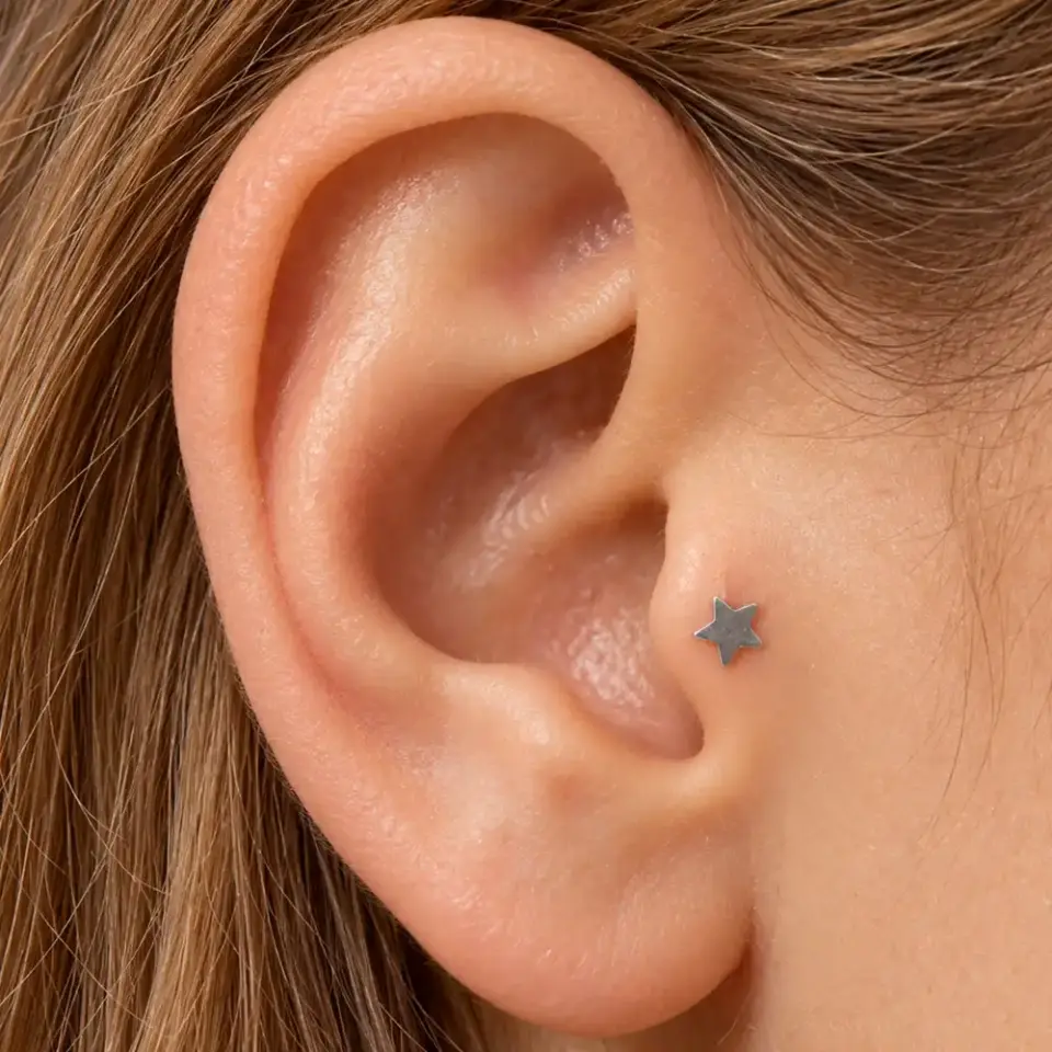gumus-yildiz-tragus-piercing