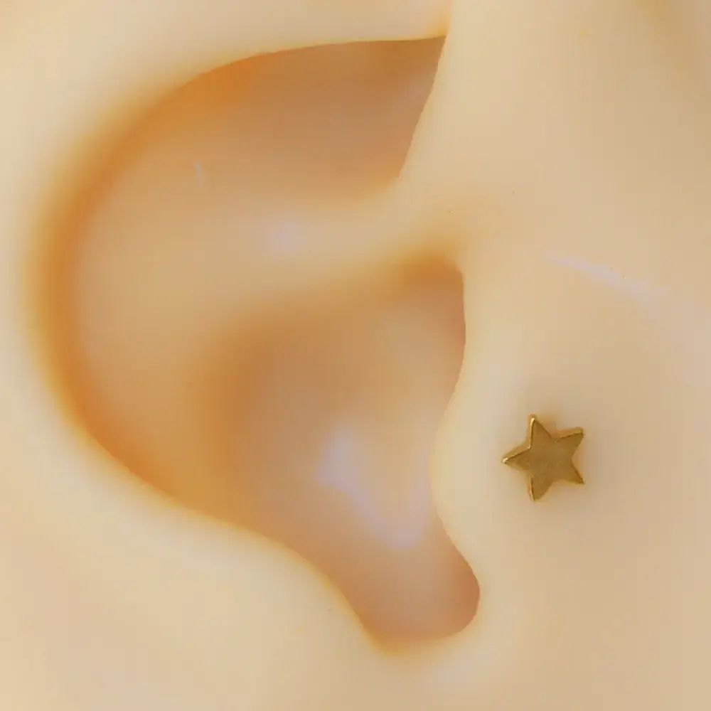 Sarı altın renk modern yıldız tasarım 316L cerrahi çelik tragus piercing