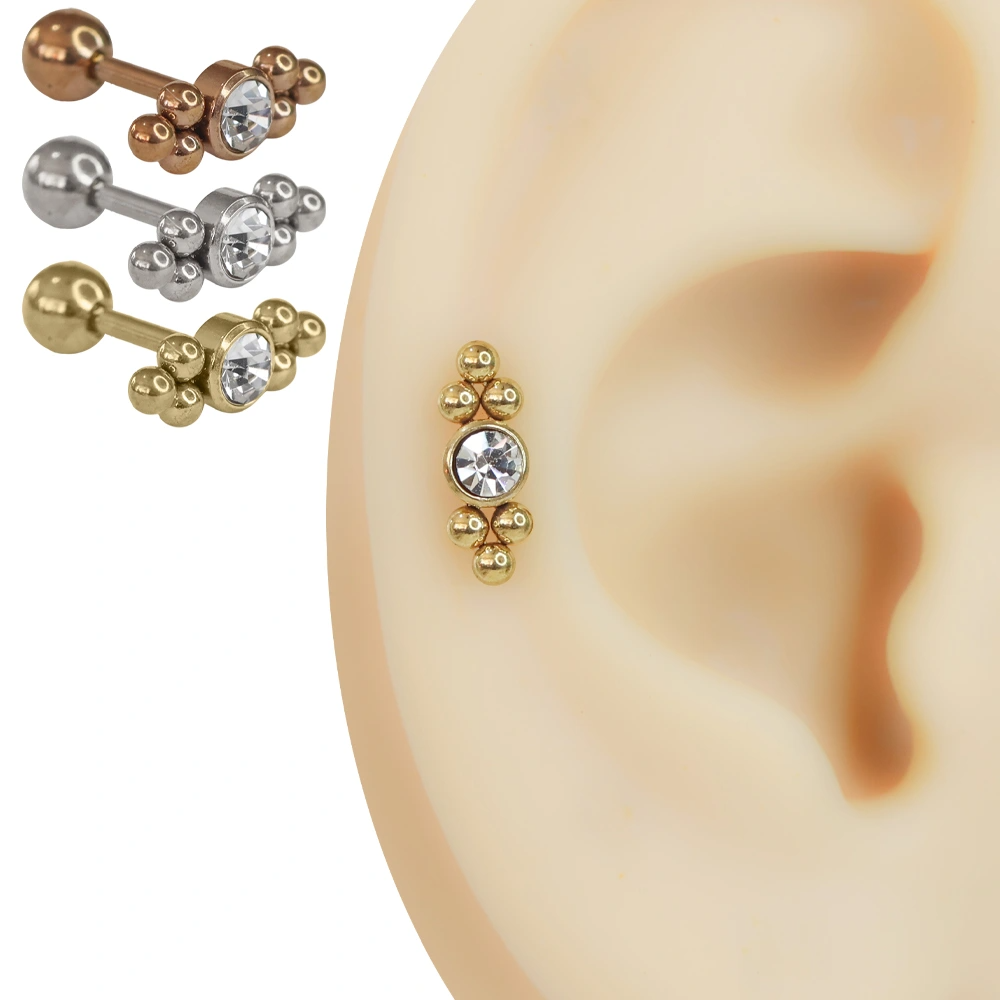 Yapay kulak modelinde duran rose, gümüş ve sarı renkli zirkon taşlı cerrahi çelik helix piercing modelleri