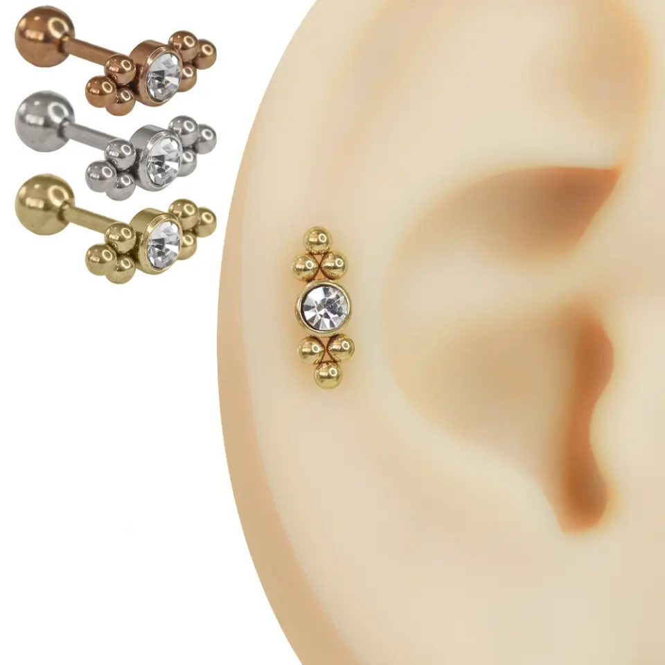 Yapay kulak modelinde duran rose, gümüş ve sarı renkli zirkon taşlı cerrahi çelik helix piercing modelleri