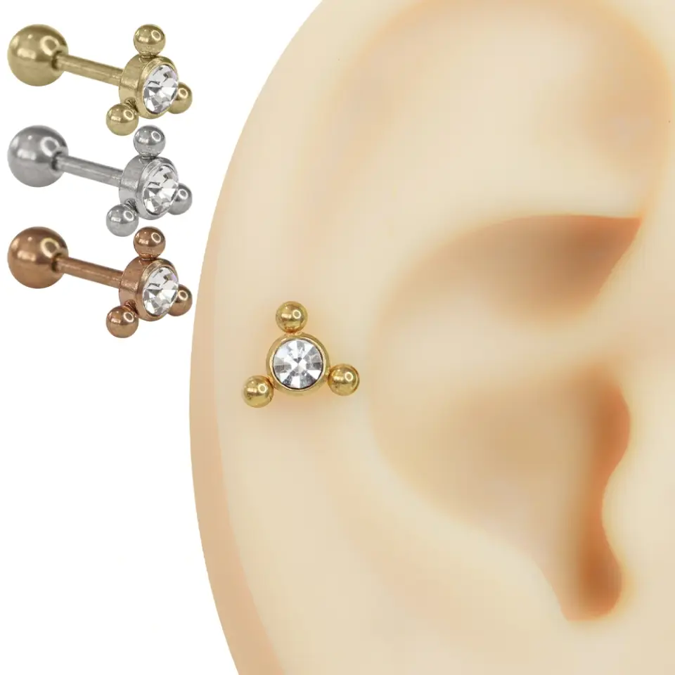Gümüş, sarı ve rose renk seçenekleriyle yan yana duran üç adet üç top detaylı zirkon taşlı cerrahi çelik piercing modeli