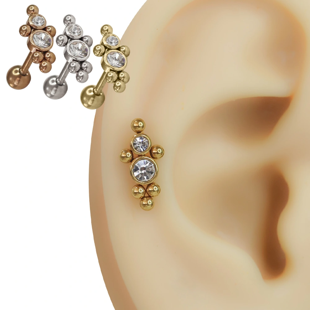Rose, gümüş ve sarı renk seçenekleriyle kulak üzerinde sergilenen zirkon taşlı helix piercing ve 316L cerrahi çelik bar tasarımı.