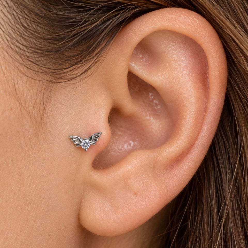 kanatli-tas-tragus-piercing